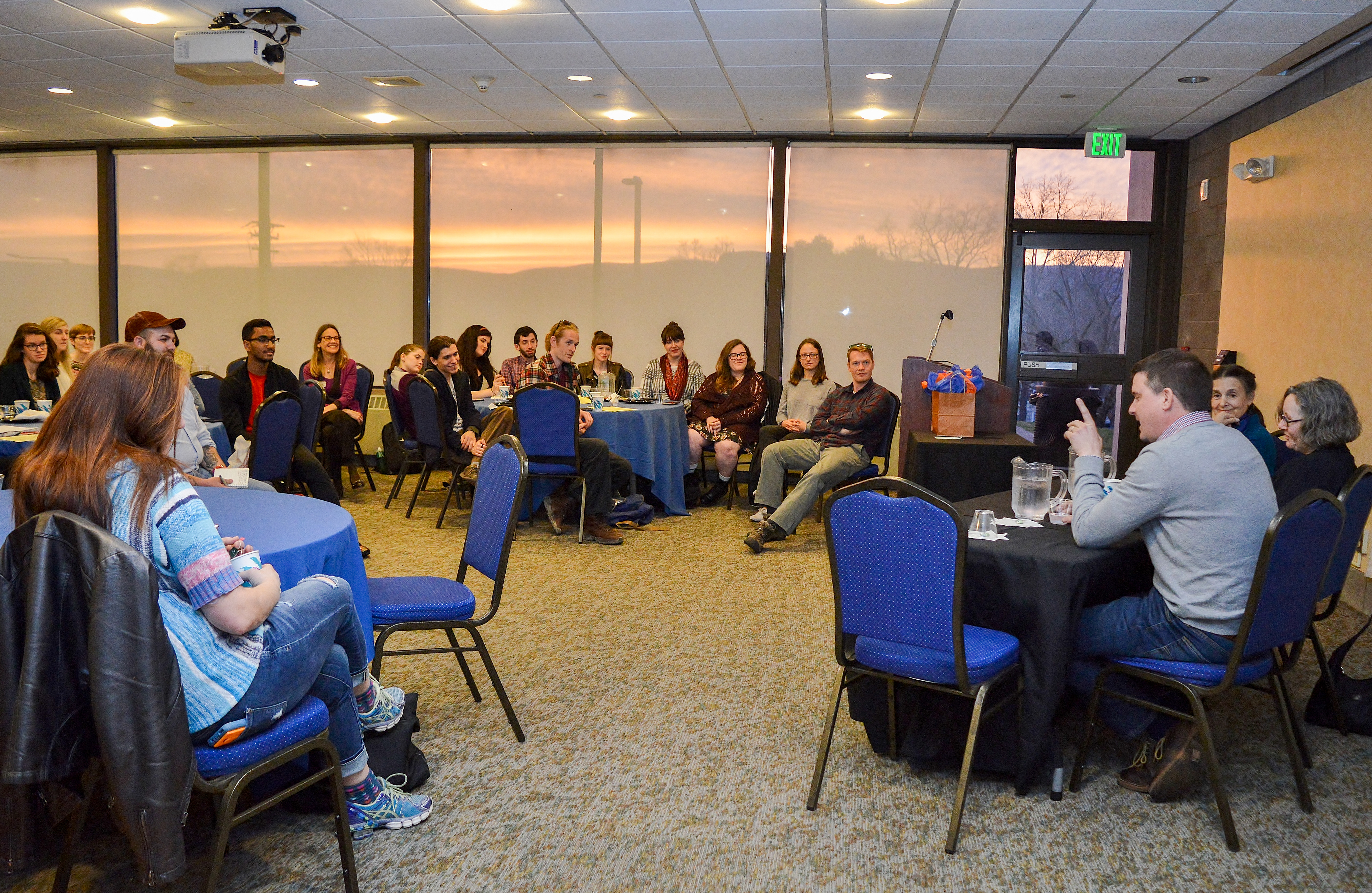 A beautiful sunset is the backdrop for a wonder evening discussion by alumni about career paths for art history majors